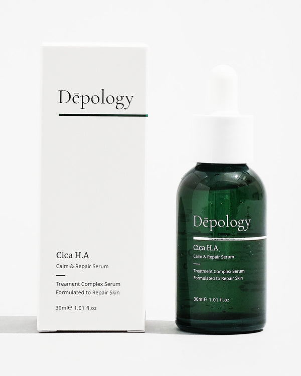 A bottle of Dépology Cica H.A Calm & Repair Serum alongside its packaging box.