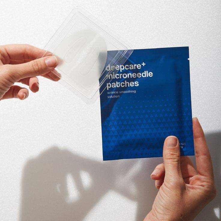 Woman applying microneedling patch at home for anti-aging skin treatment