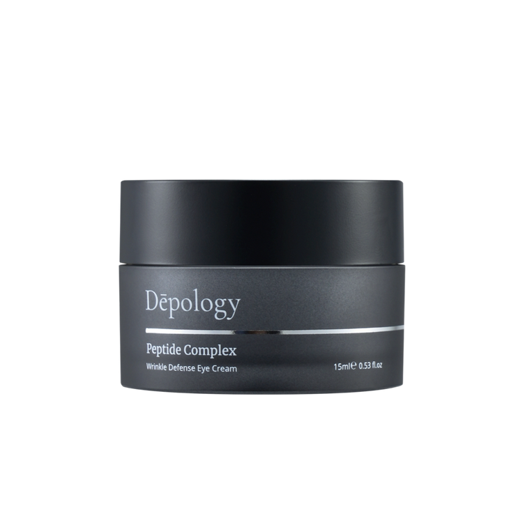 Black eye cream jar labeled 'Depology Peptide Complex' on a white background